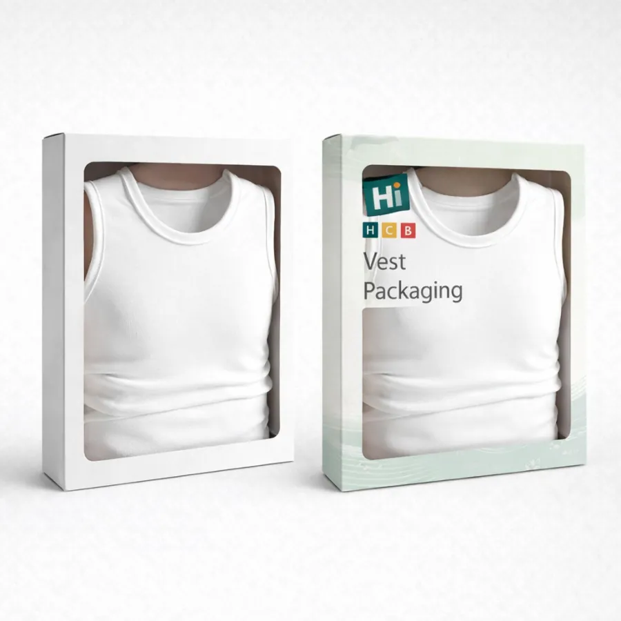 Two rectangular boxes with large windows displaying a folded white cotton vest inside each-